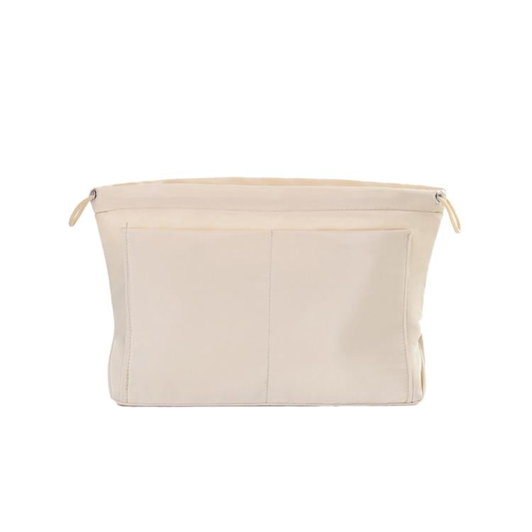 Apricot fabric mini organizer pouch insert with top drawstring and interior divider seams