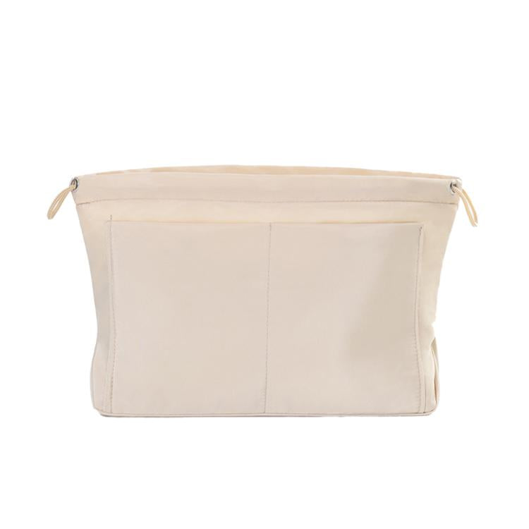 Light apricot fabric mini organizer pouch insert with top drawstring and interior divider seams