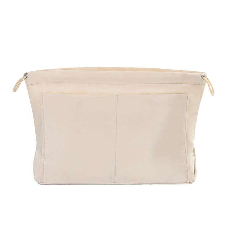 Cream apricot fabric mini organizer pouch insert with top drawstring and interior divider seams