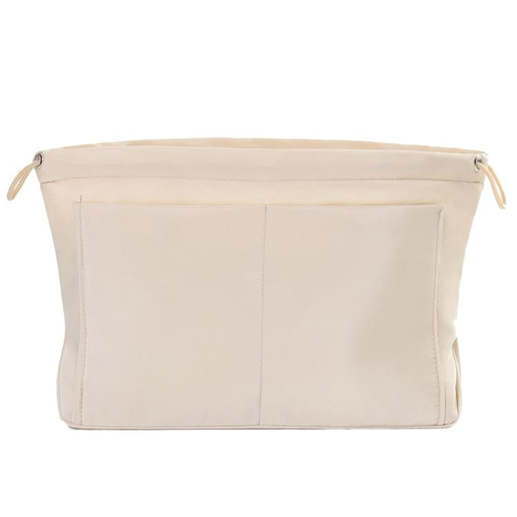 Apricot light fabric mini organizer pouch insert with top drawstring and interior divider seams