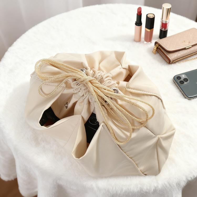 Mini bag organizer insert pouch in apricot-beige, drawstring closure tied at the top