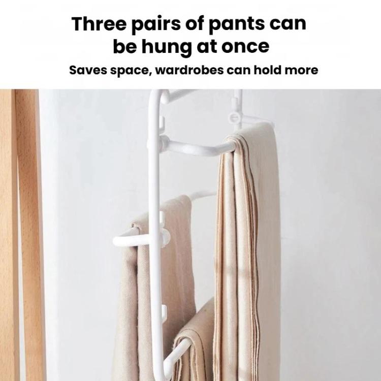 White multi-layer pants hanger rack holding three pairs of folded pants