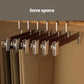 Wooden pants hangers on rod with multiple black clamp clips