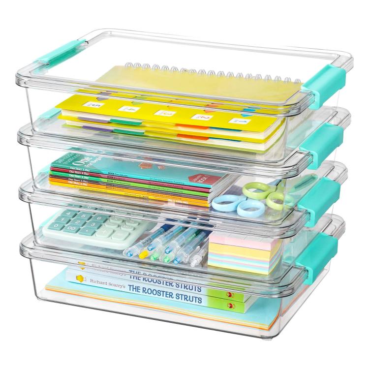 Stack of clear storage boxes with teal latch lids holding stationery
