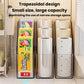 Clear kitchen wrap storage rack holding plastic wrap rolls in a countertop organizer