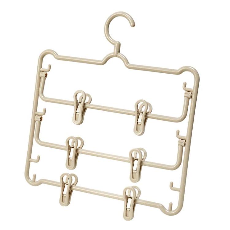 Beige plastic anti-slip 3-tier pants hanger with multiple clips and side hooks