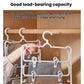 White plastic 3-tier pants hanger with clips holding pants and skirts