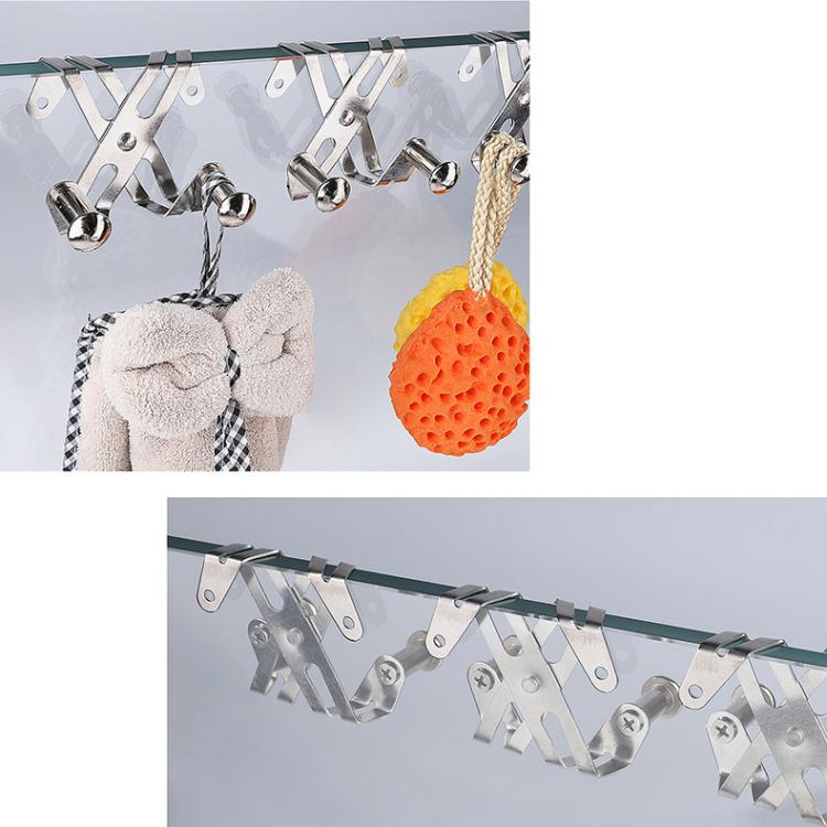 Silver towel hooks for shower glass door holding towels, rope, and sponge