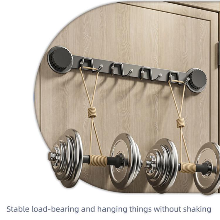 Black suction cup multi-hook rack on a door with several hanging hooks