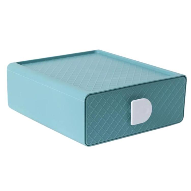 Light blue plastic drawer organizer with diamond-textured sides and white handle cutout