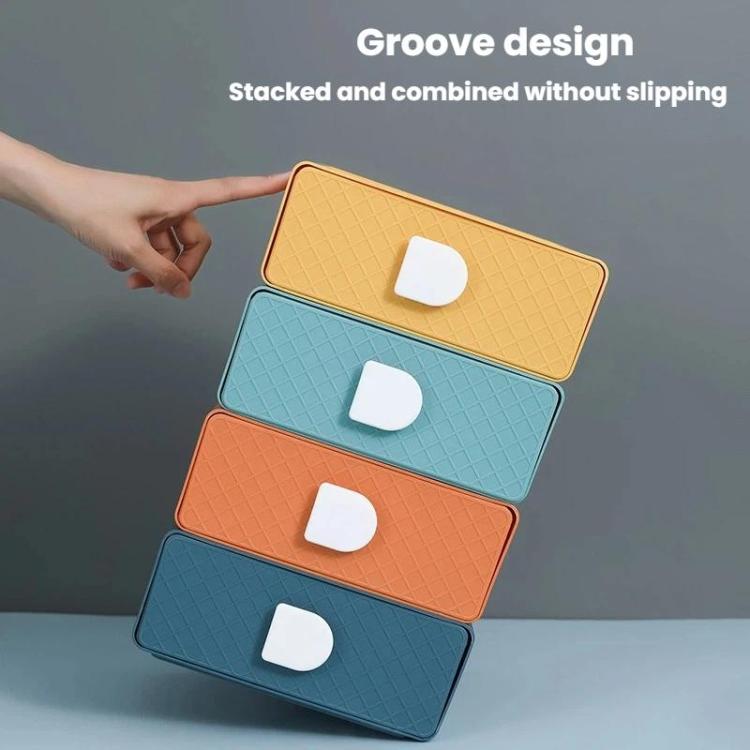 Stacked plastic drawer organizers in yellow, blue, and orange with white handle cutouts