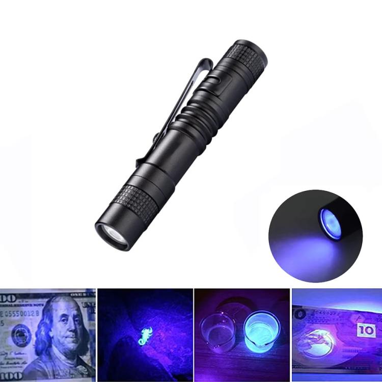 Black mini handheld flashlight with purple light beam in spotlight view