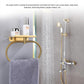 Gold stainless steel towel ring with shelf for holding bathroom towels.