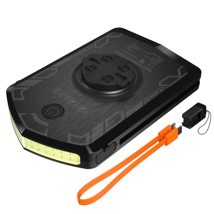 Black bike warning light with flashing LEDs and orange charging cable