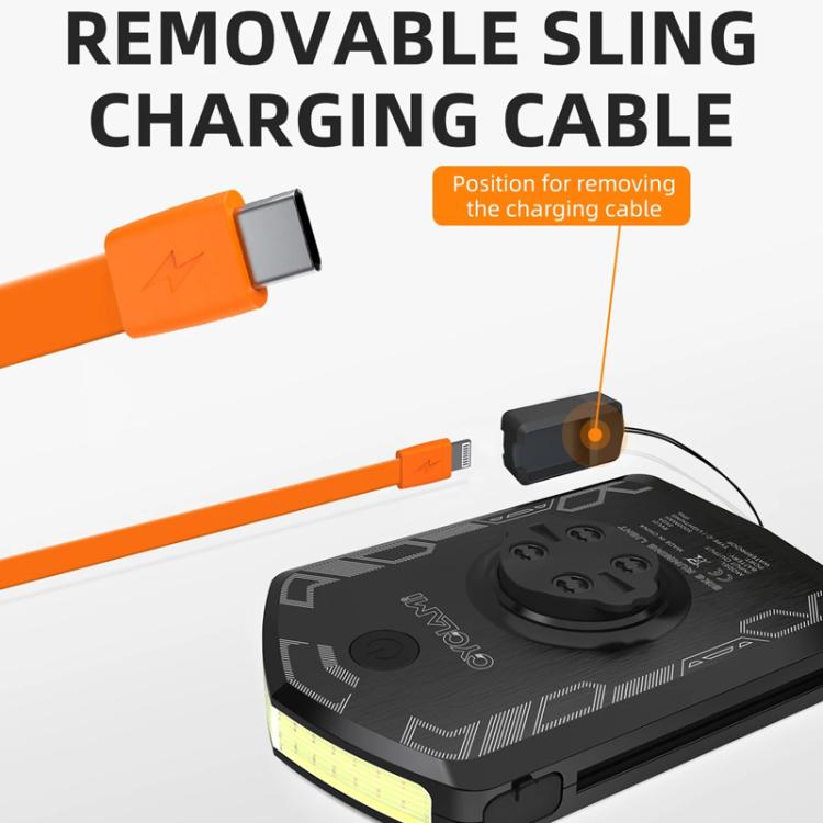Removable orange charging cable attached to black bike light