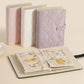 Set of quilted jewelry organizer books in lavender, white, and light pink with snap closures.