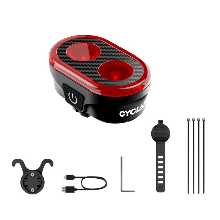 Rear bicycle taillight with red oval lens, black housing, and accessory parts