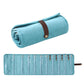 Light blue roll-up velvet jewelry organizer bag with brown strap and rows of pockets