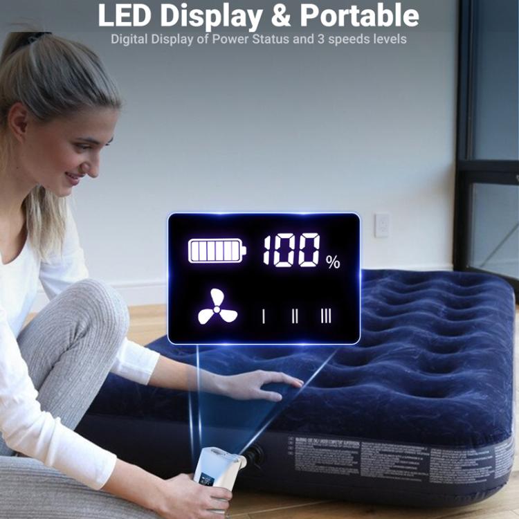 White mini air pump with LED digital display inflating an air mattress