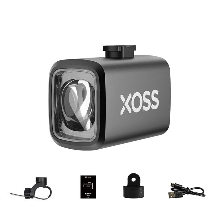 XOSS Mini bike headlight with black housing, front lens, and mounting accessories