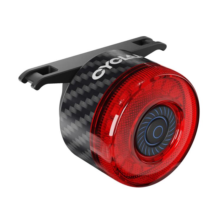 Carbon fiber bicycle rear warning light with red circular lens and blue center ring