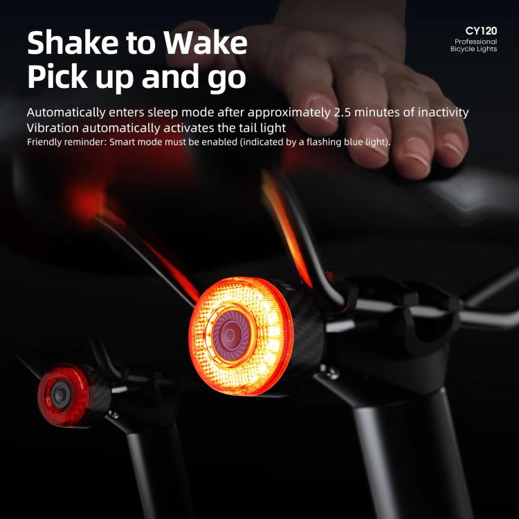 Bicycle rear light with amber glow and red lens mounted on handlebars