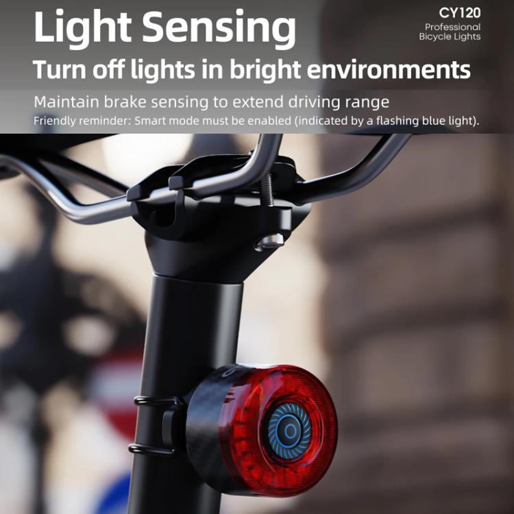 Bicycle rear light with red lens mounted under the handlebars