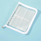 White clear PVC zipper pouch with four-pocket inner pages and binder rings