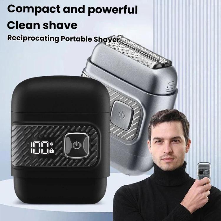 Portable reciprocating electric shaver with LCD screen, shown in silver and black