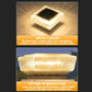 Warm glowing solar LED pillar light with square glass top and solar panel