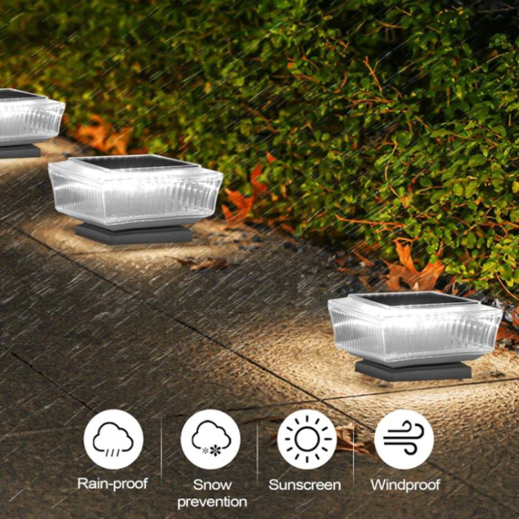 Multiple waterproof solar LED pillar lights with clear ribbed diffusers on patio