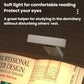 Clip reading lamp with LED folding bookmark shining over an open book, soft light.