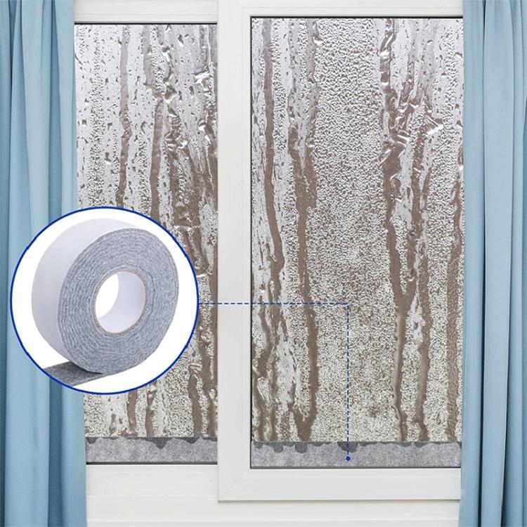 Gray adhesive felt strip applied around a window frame for anti-condensation