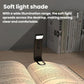 Black clip-on LED mini bookmark lamp lighting an open book