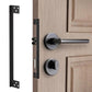 Black L-shaped latch protector cover mounted beside door lock and handle
