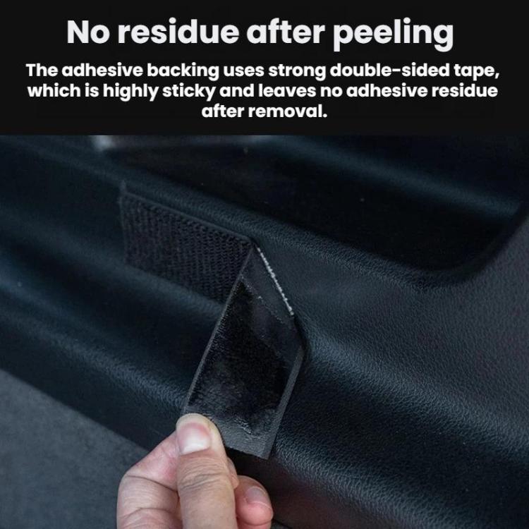 Black double-sided adhesive tape backing with peel corner on dark trim