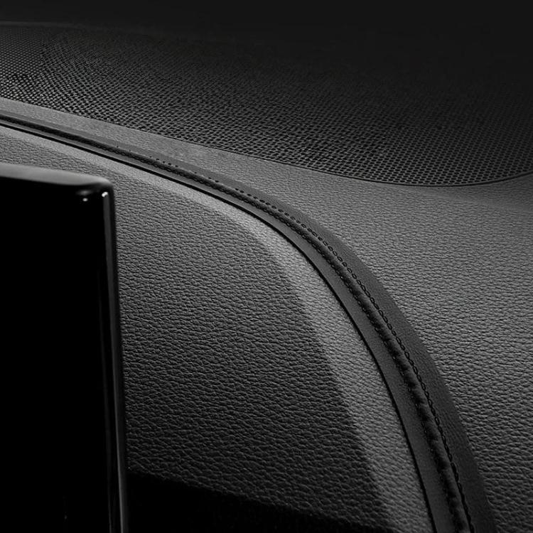 Black leather-style car interior trim strip with dark stitched edge detail