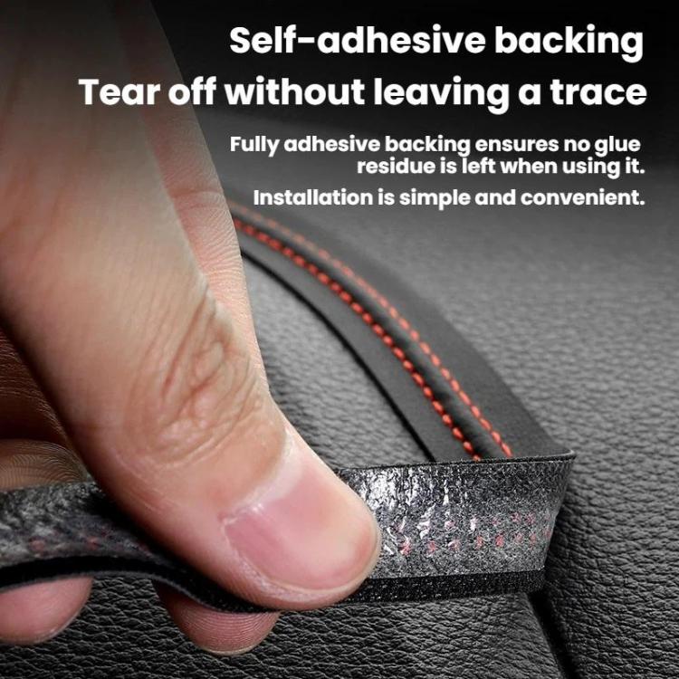 Leather-style trim strip held by hand with black surface and red stitched edge