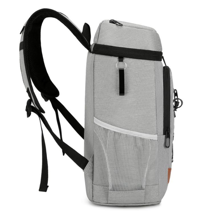 Light gray insulated cooler backpack with adjustable shoulder straps and side carry handle