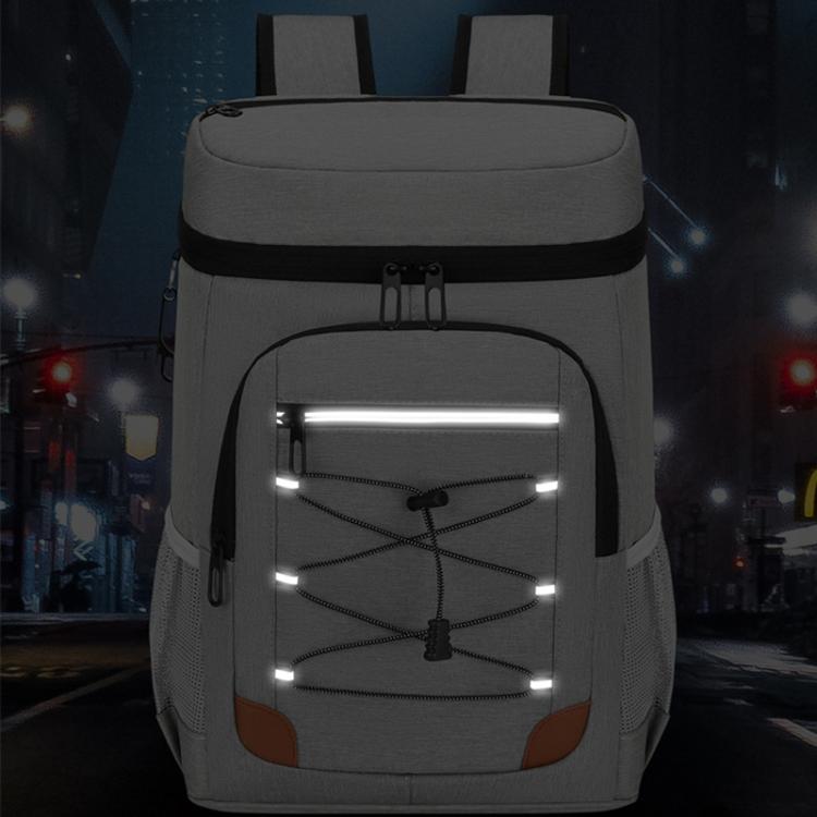 Light gray insulated cooler backpack with front zip compartment and interior light grid