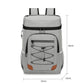 Light gray insulated backpack cooler with front zipper compartment and orange base