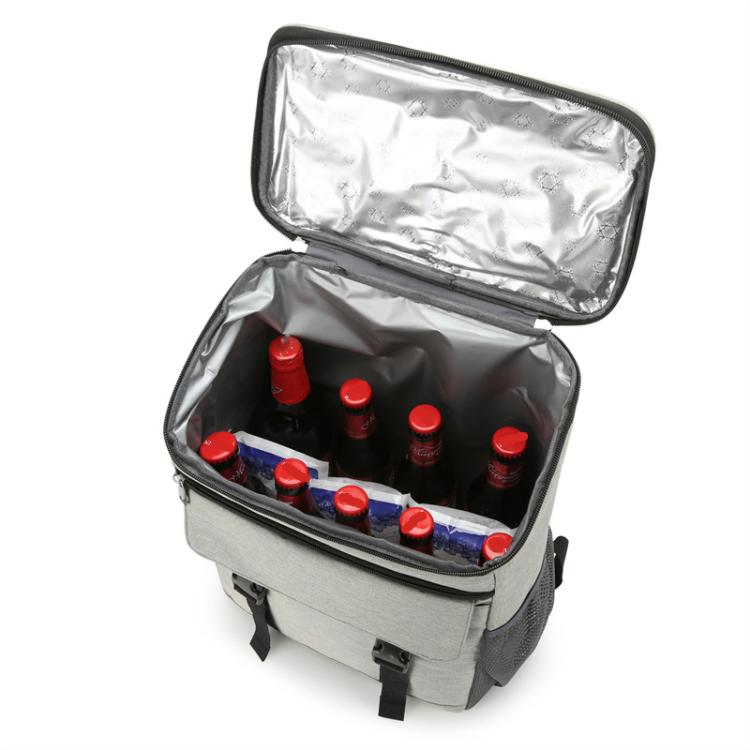 Vanaheimr insulated hiking backpack with open foil-lined interior and bottles stored inside.