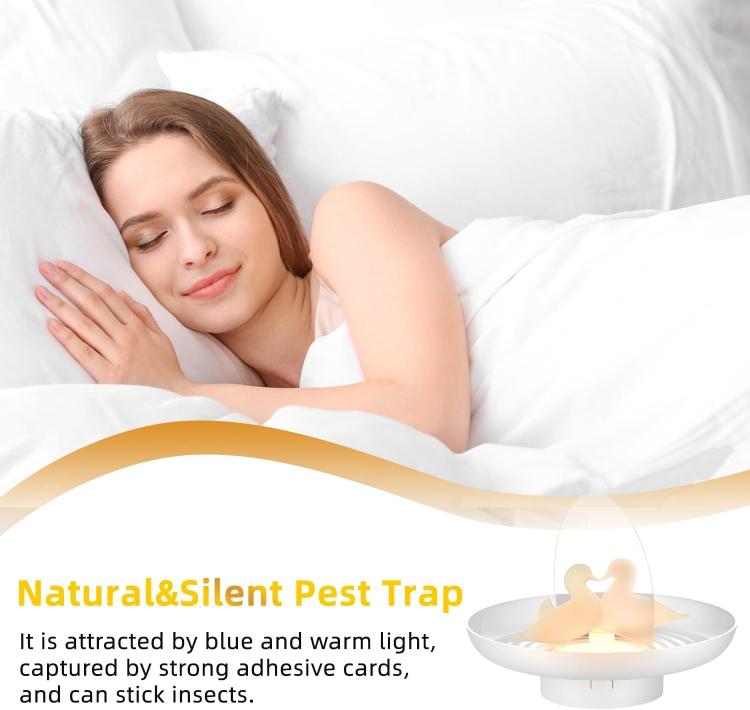 White glowing flea trap on bedside setting near a sleeping person