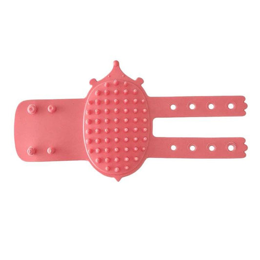 Pink rubber pet itch scratcher massage tool with spiked oval pad and two straps