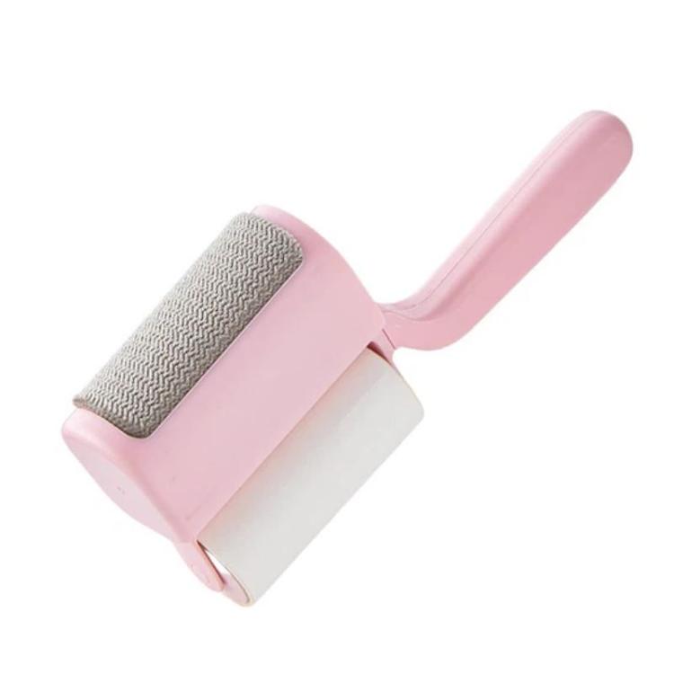 Household lint roller brush with pink handle and soft gray bristles roller