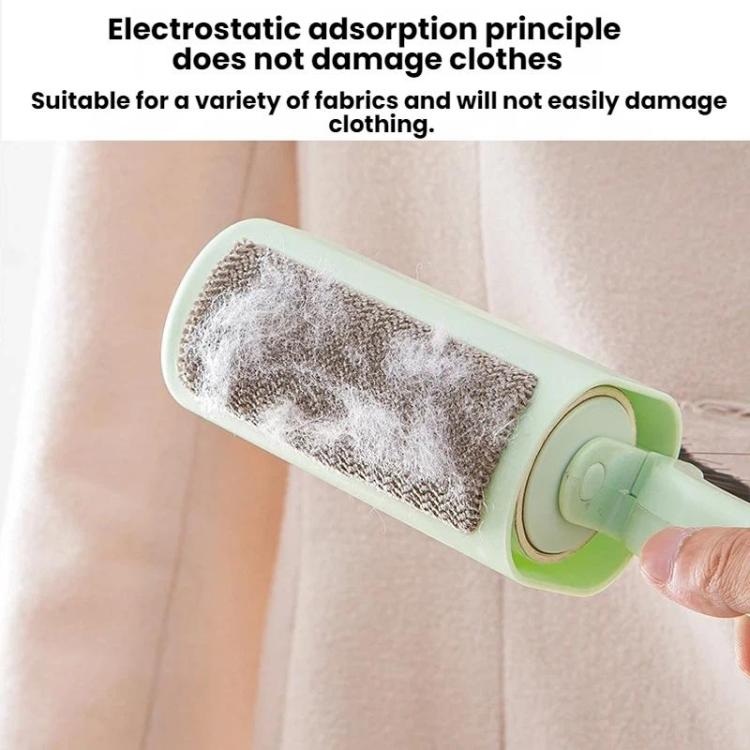 Lint roller brush with mint green roller on fabric, removing lint