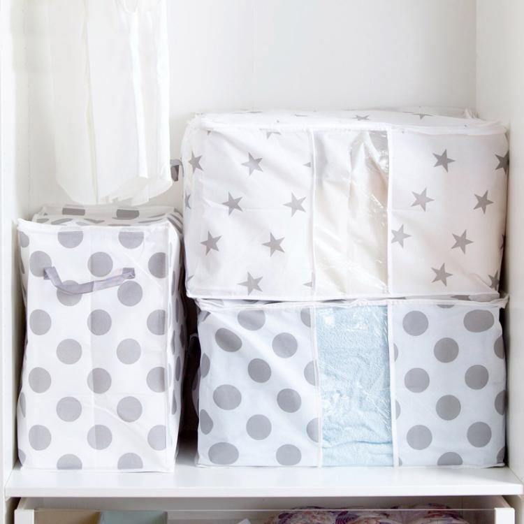 Stacked cube storage bags with gray dot and star prints and see-through window panels
