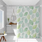 Leaf-pattern shower curtain with green and yellow leaves on white, ring-top hanging