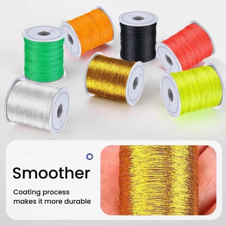 Assorted fishing rod guide tying line spools in multiple colors on a board