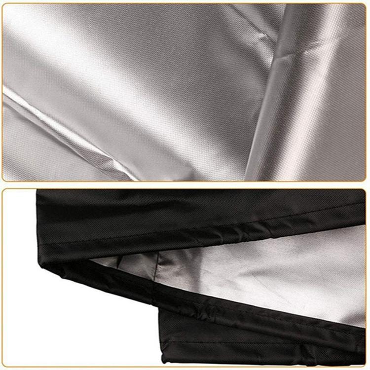 Silver fabric telescope cover with black trim and stitched hem details